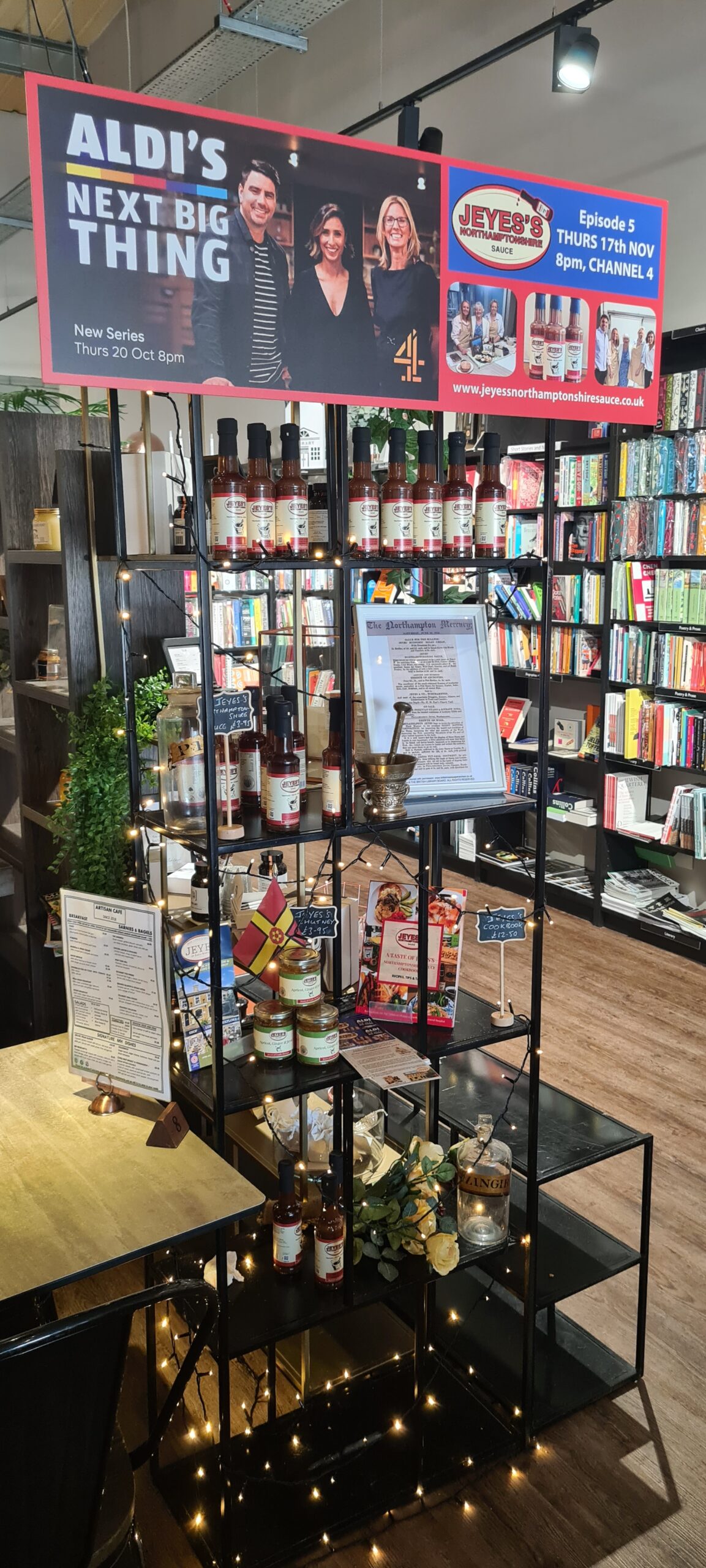 IMAGE: A black display unit with a variety of Jeyes's Northamptonshire Sauce products. A mortar and pestle and twinkling lights are also on display.